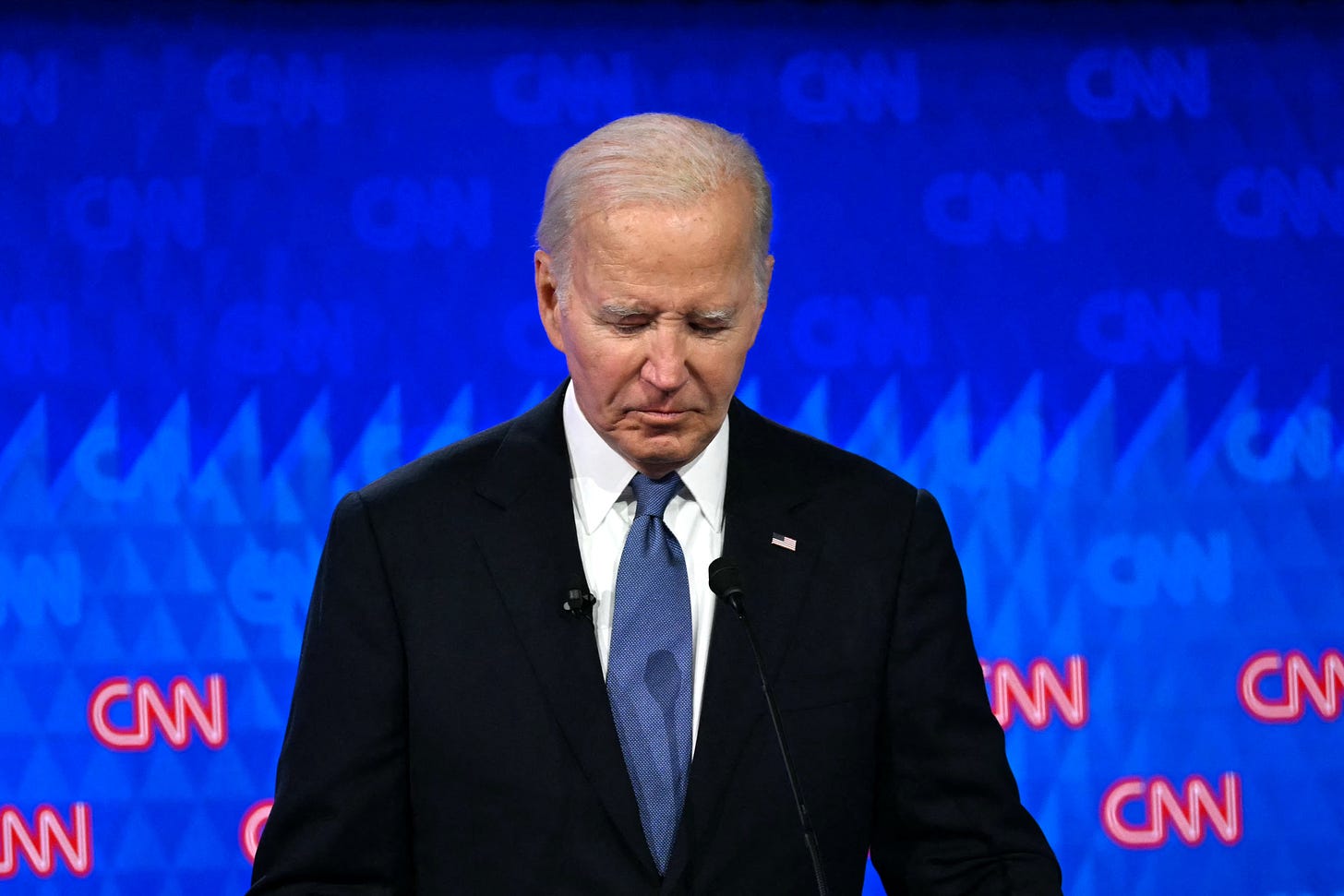 (President Joe Biden looks down as he participates in the first presidential debate of the 2024 election on June 27, 2024. Photo by Andrew Caballero-Reynolds/AFP via Getty Images)