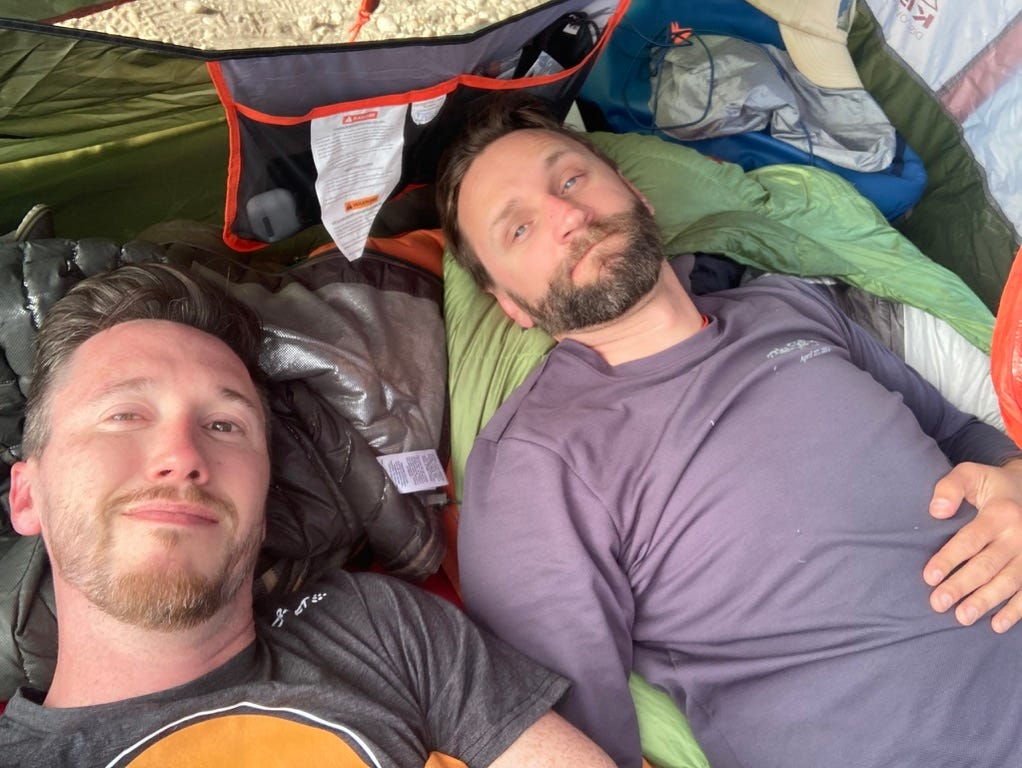 Two men lying in a tent

Description automatically generated with medium confidence