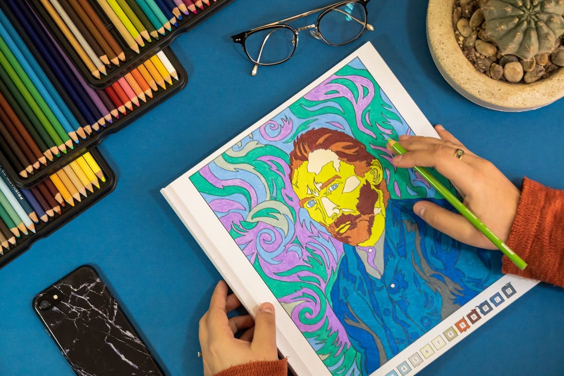 Free A Person Holding a Coloring Book Stock Photo