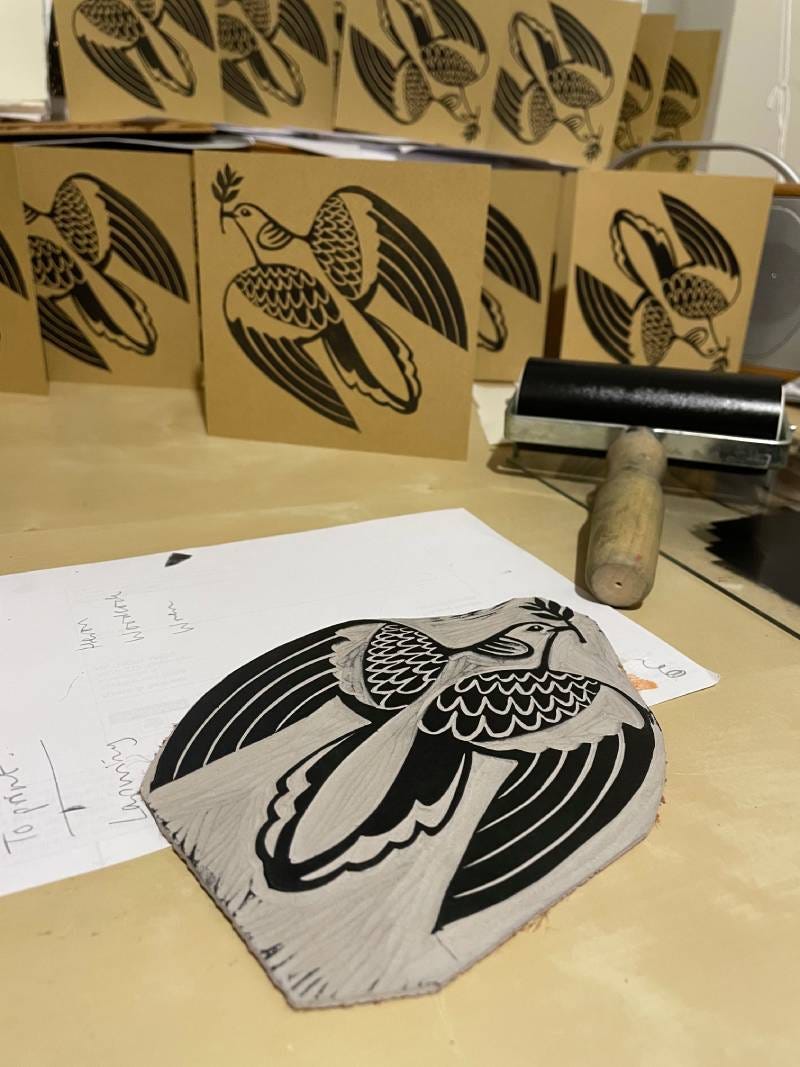 Lino block with turtle dove design and cards printed from it
