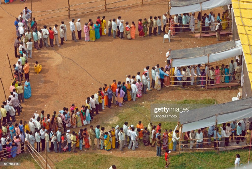 Voters standing in queue to cast vote Bombay Mumbai, Maharashtra, India