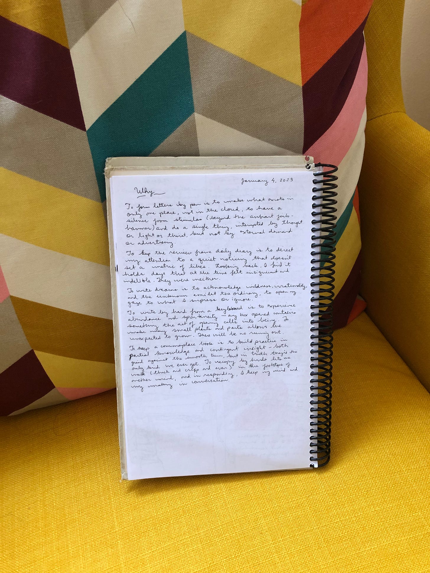 picture of a notebook sitting on a yellow chair