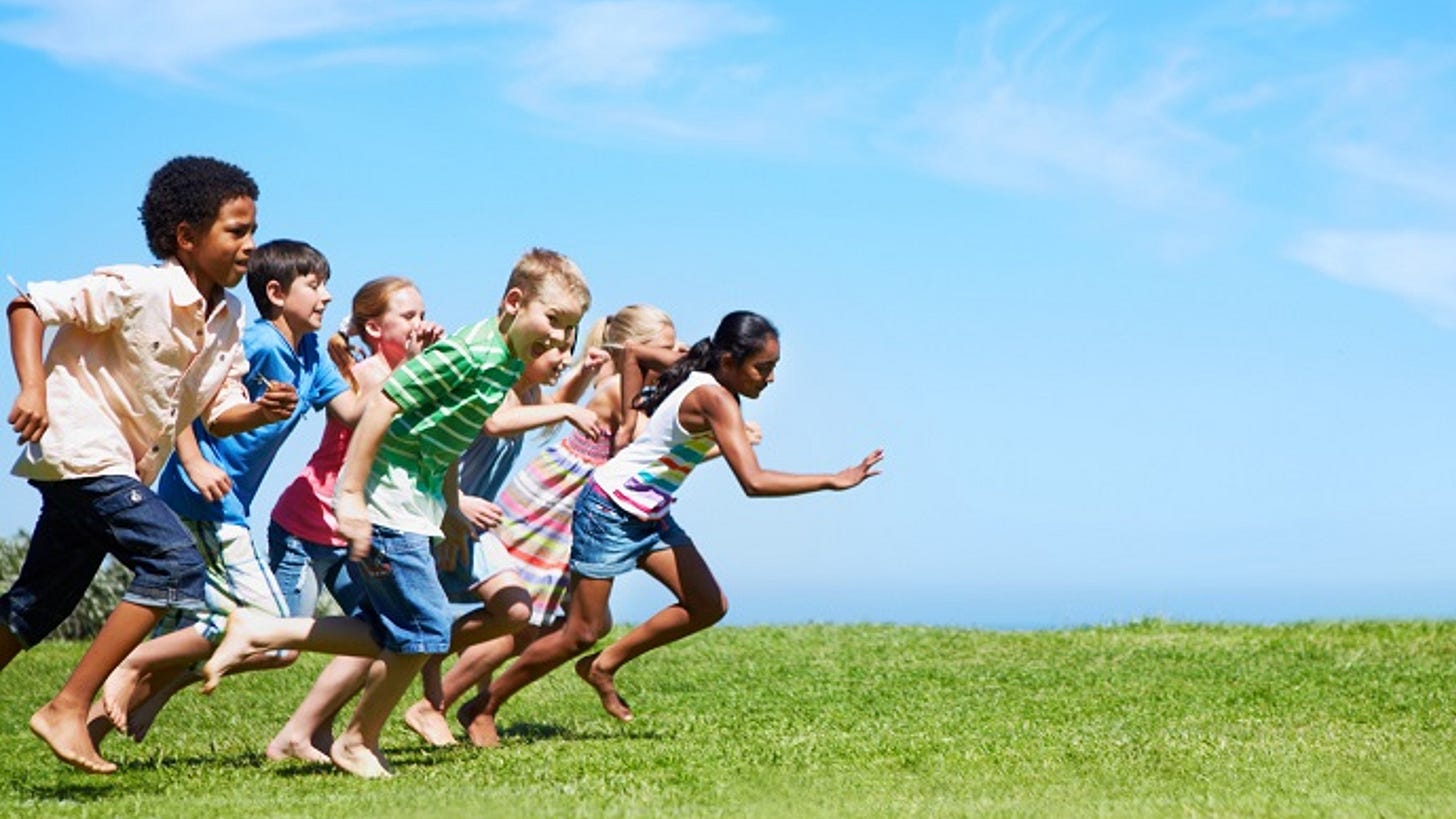 photo of group of children running