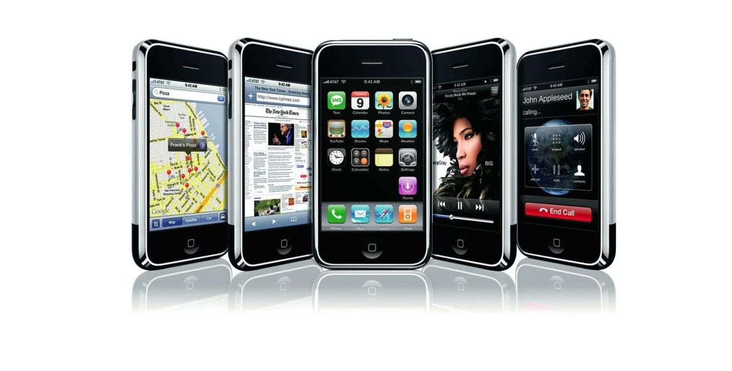 A group of 5 iPhone 2gs are shown in front of a white background.