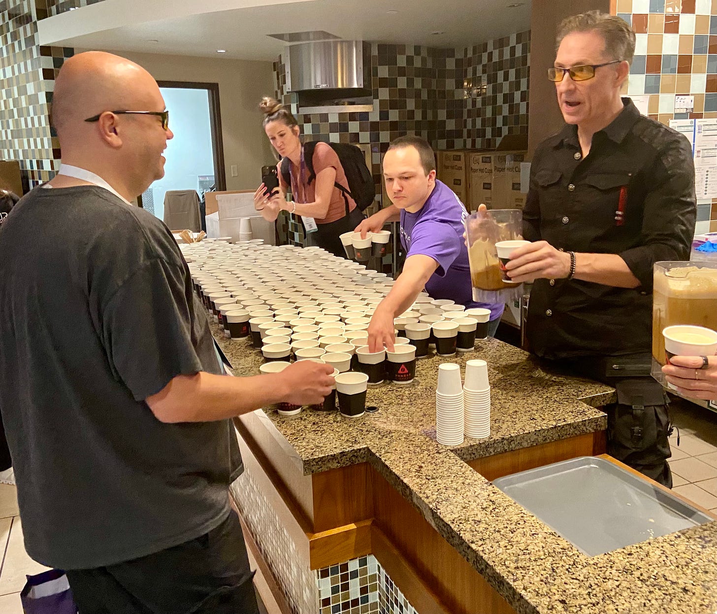 Dave Asprey serving me Danger Coffee at the 2023 Biohacking Conference
