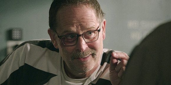 STan smiling with fingers in prison scene on Walker 2.08.