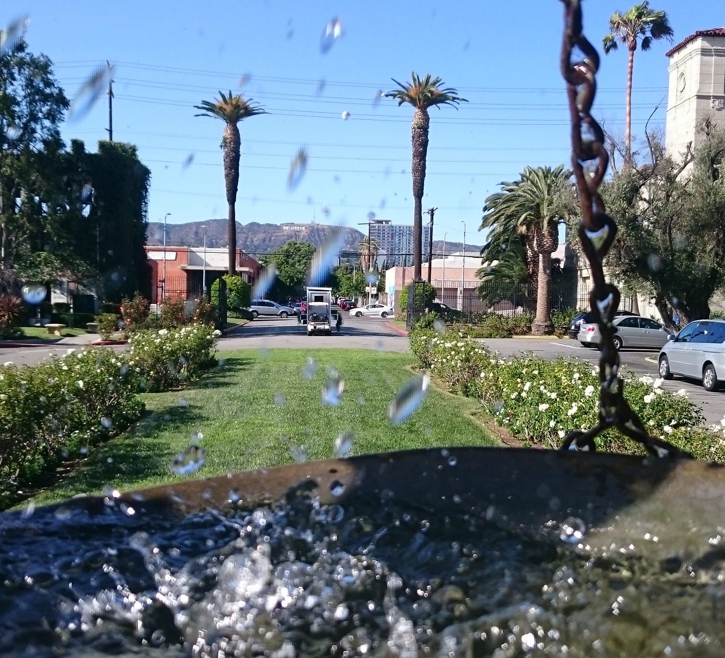 View north towards the Hollywood sign from the front gate of Hollywood Forever Cemetery