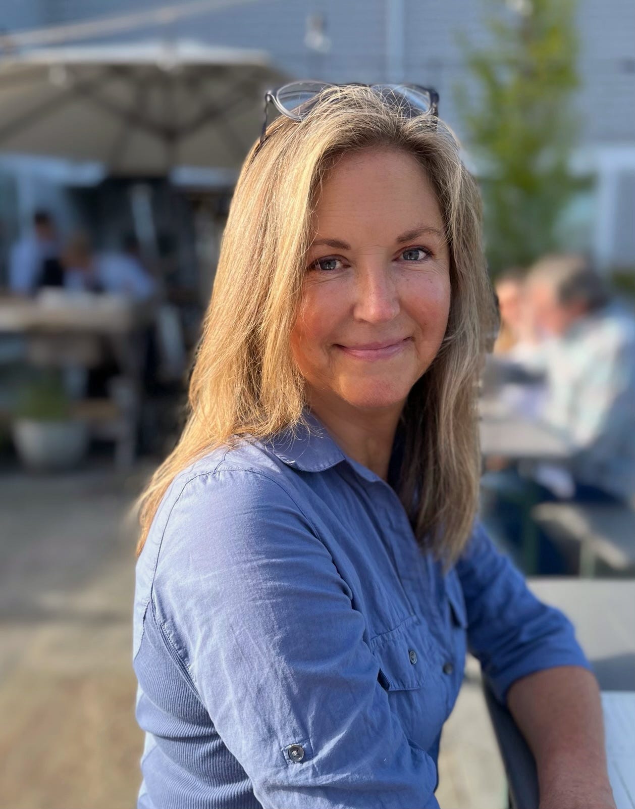 A photograph of Tracy Livecchi in a blue shirt.