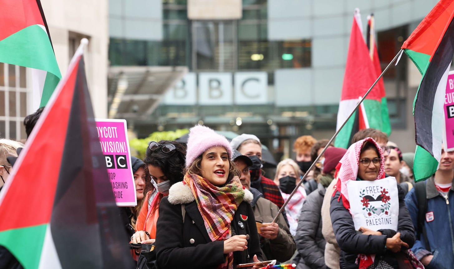 Protests outside the BBC in central London. Protesters are waving Palestinian flags and pro-Palestine placards.