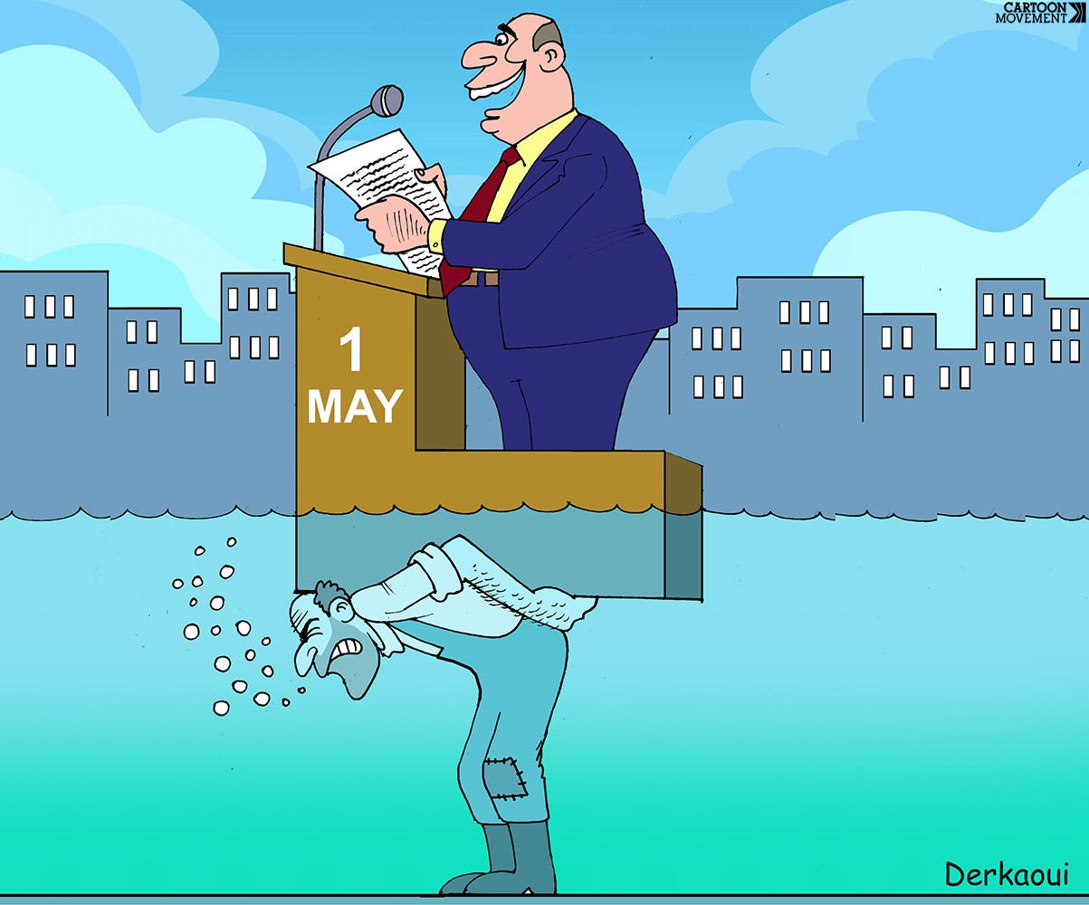 Cartoon showing a politician making a speech from behind a lectern. The lecterns is labeled ‘May 1’. The lectern and politician are being carried on the back of a laborer, who is standing underwater, keeping the politician and lectern dry.