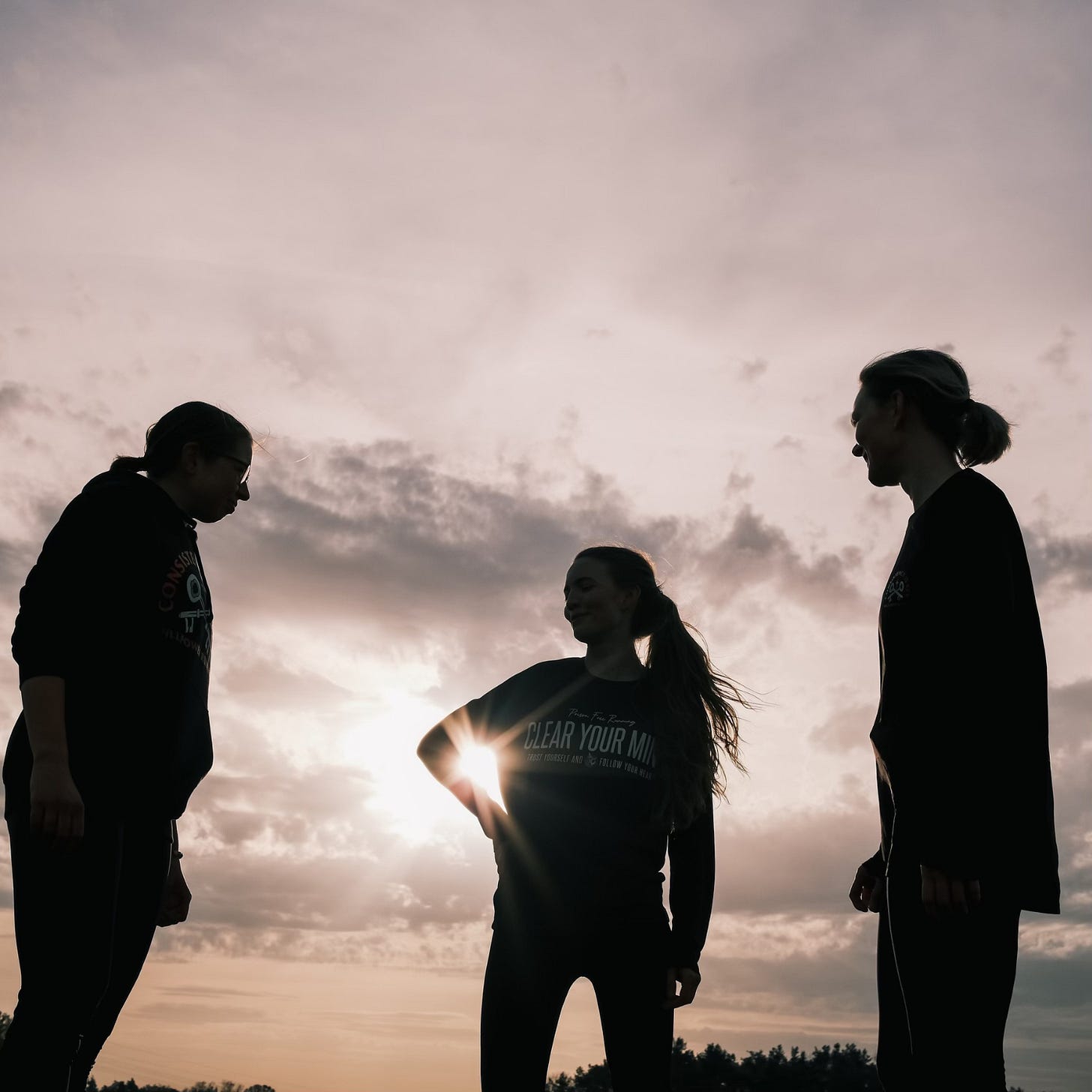 three female runners at sundawn