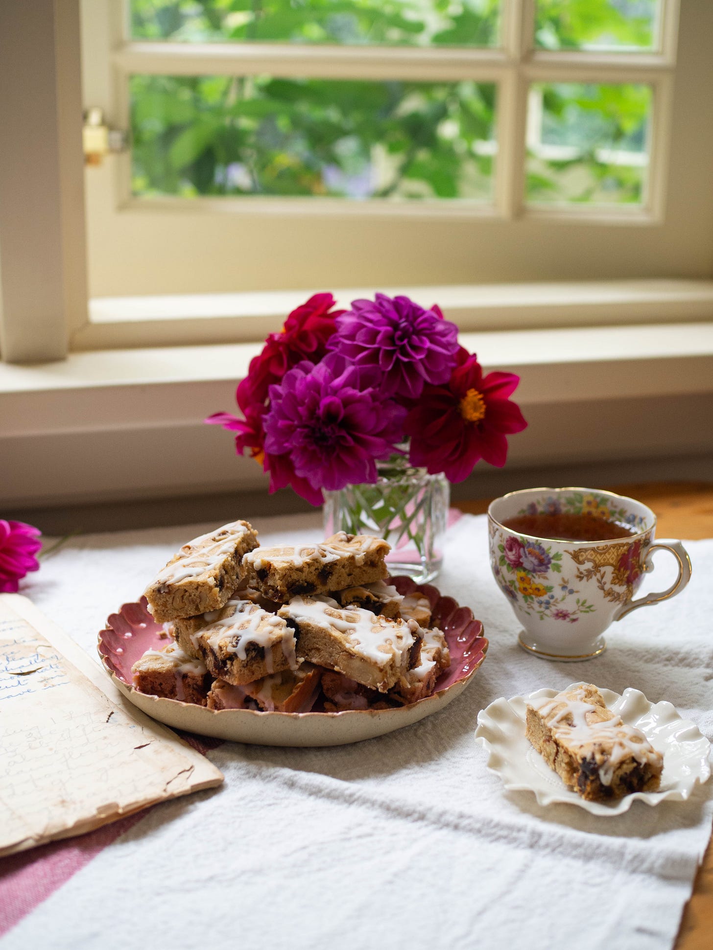 Caramel Fingers on Pink Plate with Dahlias in Background