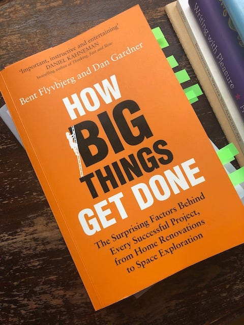 Cover of the book How Big Things Get Done, black and white text on orange background