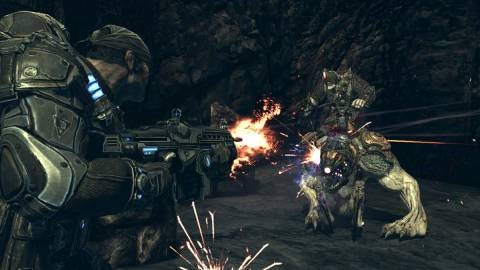 A screenshot of Marcus Fenix firing on a Bloodmount and Bloodmount rider. The Bloodmount is still wearing its mask.
