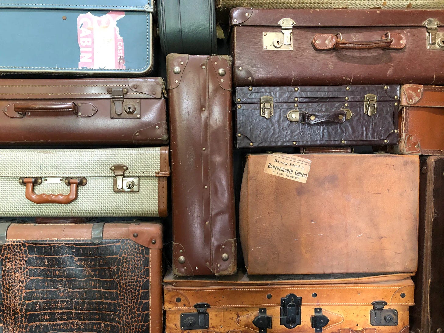 Image of several pieces of vintage suitcases
