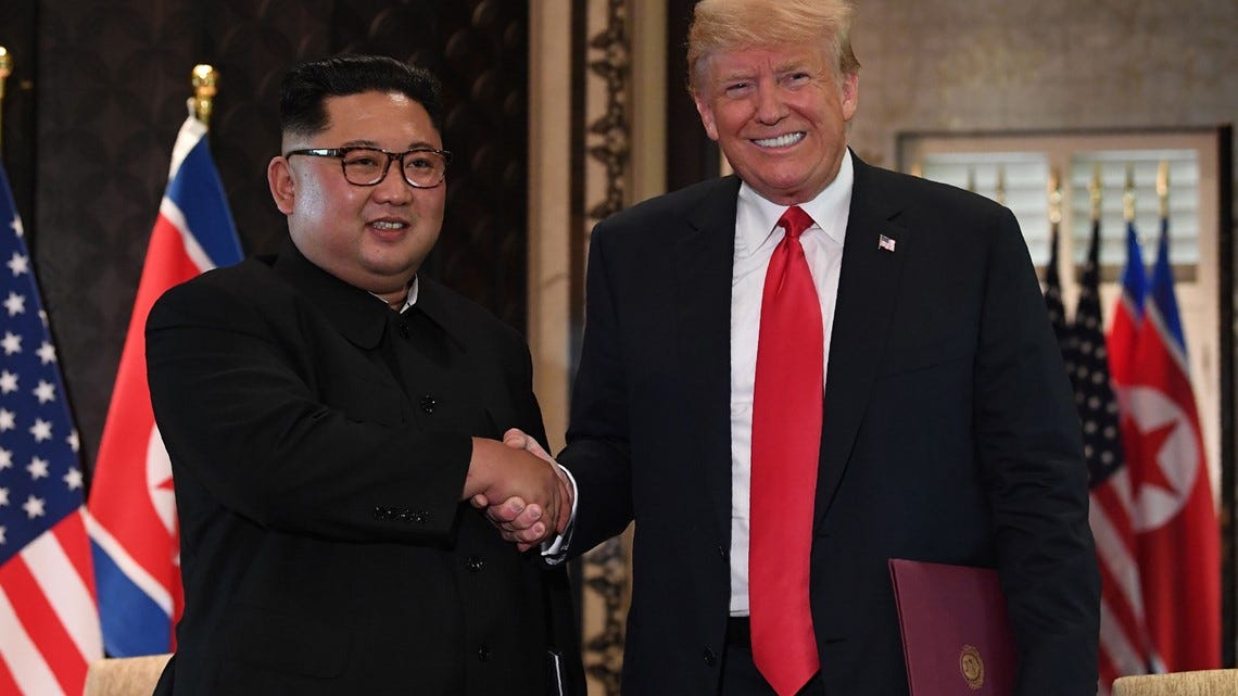 PHOTOS: President Trump and Kim Jong Un meet at historic summit ...