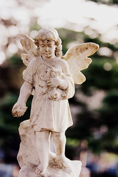 Picture of a statue of a small angel.
