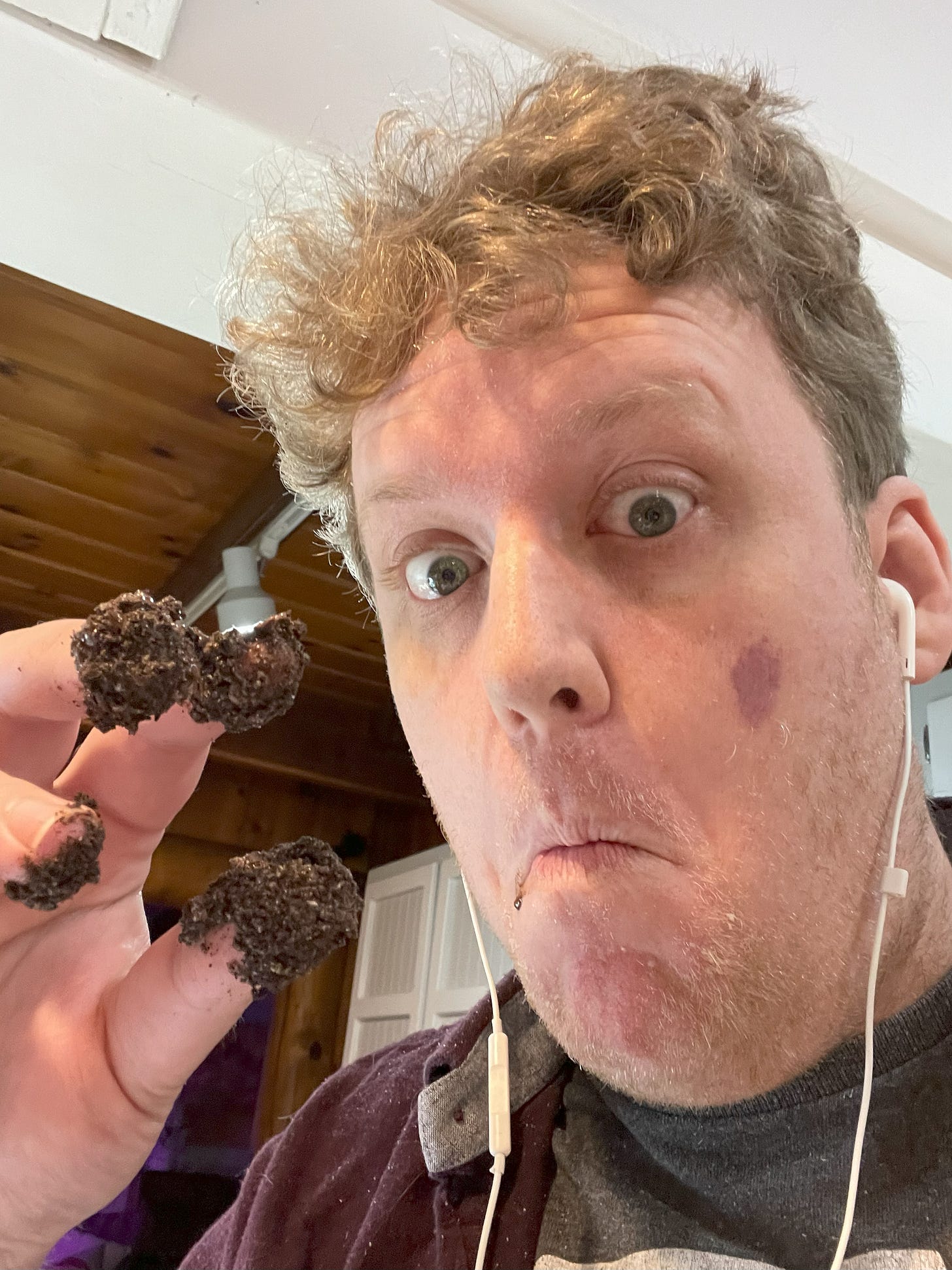 Kyle with chocolate dust on his fingers