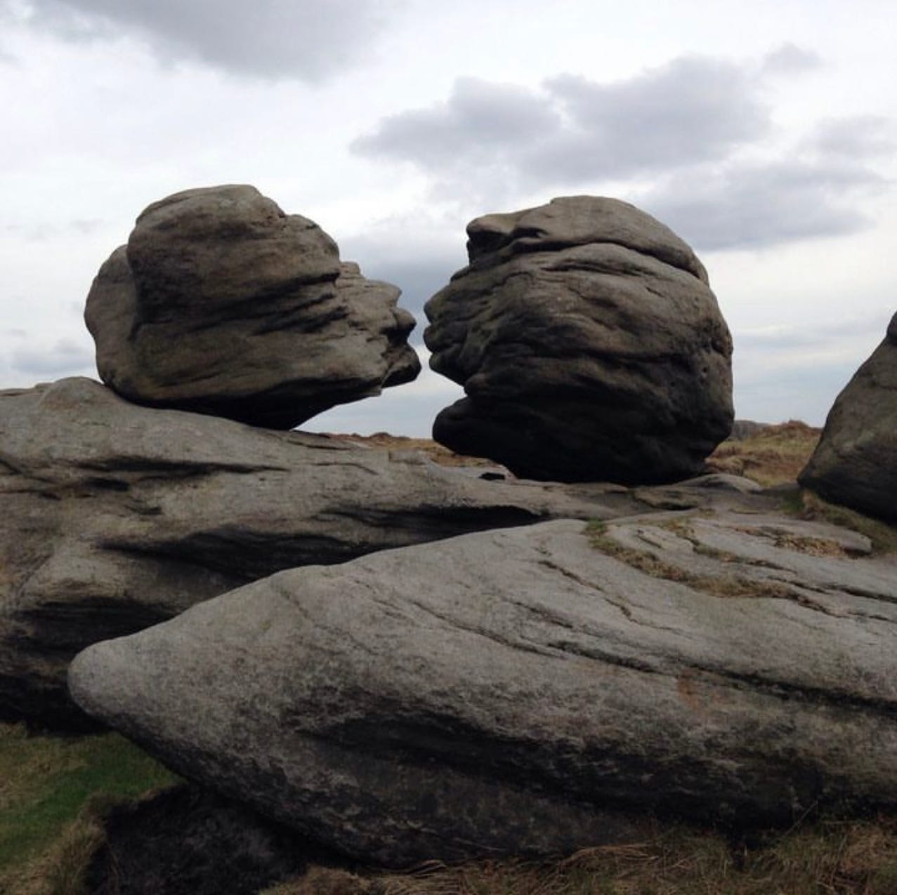 image of two large boulders which are formed in such a way it appears as if they are about to kiss