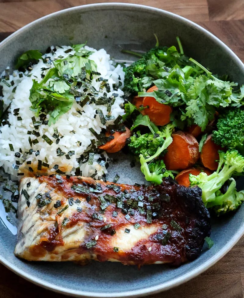 asian glazed barramundi with side of broccoli, carrots, and white rice