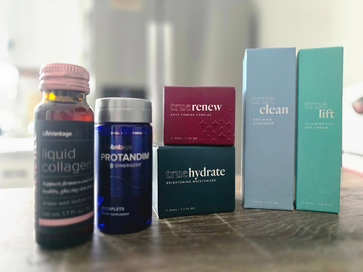 May be an image of medicine and text that says 'Lifevantage truer truerenew renew DAIL BAILYFIEMINACOMPLEX ILYFIRNINGCOMPLEX FIRMING CONPLEX Crue clean REPINING CLEANSER 3O-L-1FLO nt ROTANDIM liquid collag trme lift ILLUMINATING EYE CREAM rue hydrate BRIGHTENING MOIS URIZER BRIOHTENINGMOISTURIZER IZE'