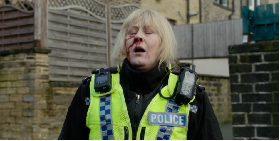 Sarah Lancashire as Catherine Cawood, a police office with blood pouring out of her nose