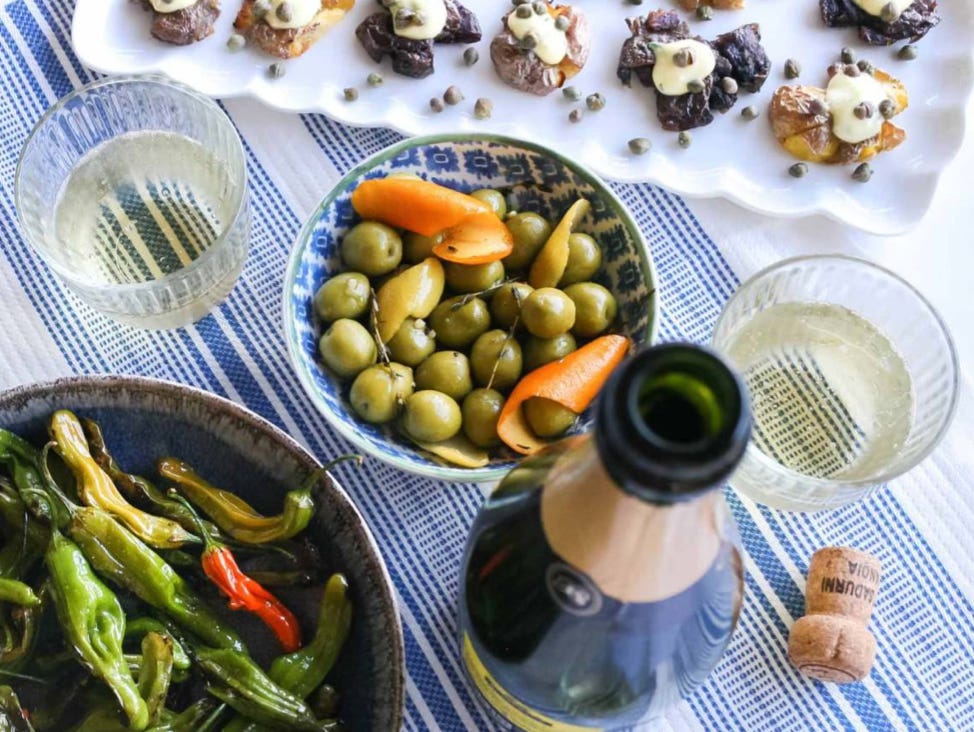 Cava, shishito peppers, olives, crispy smashed potatoes