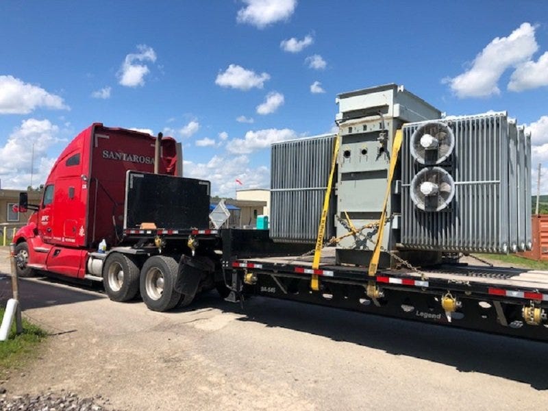 A truck hauls a transformer from EM’s West Valley Demonstration Project to a recycling facility. Funds from recycling are used to offset the site’s cleanup costs.