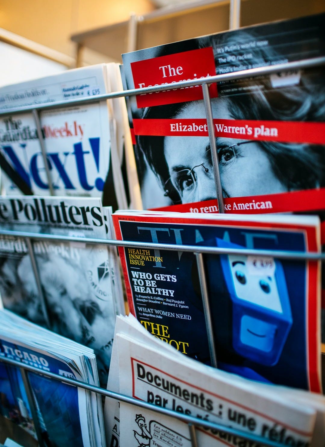 magazines displayed on a rack magazines displayed on a rack