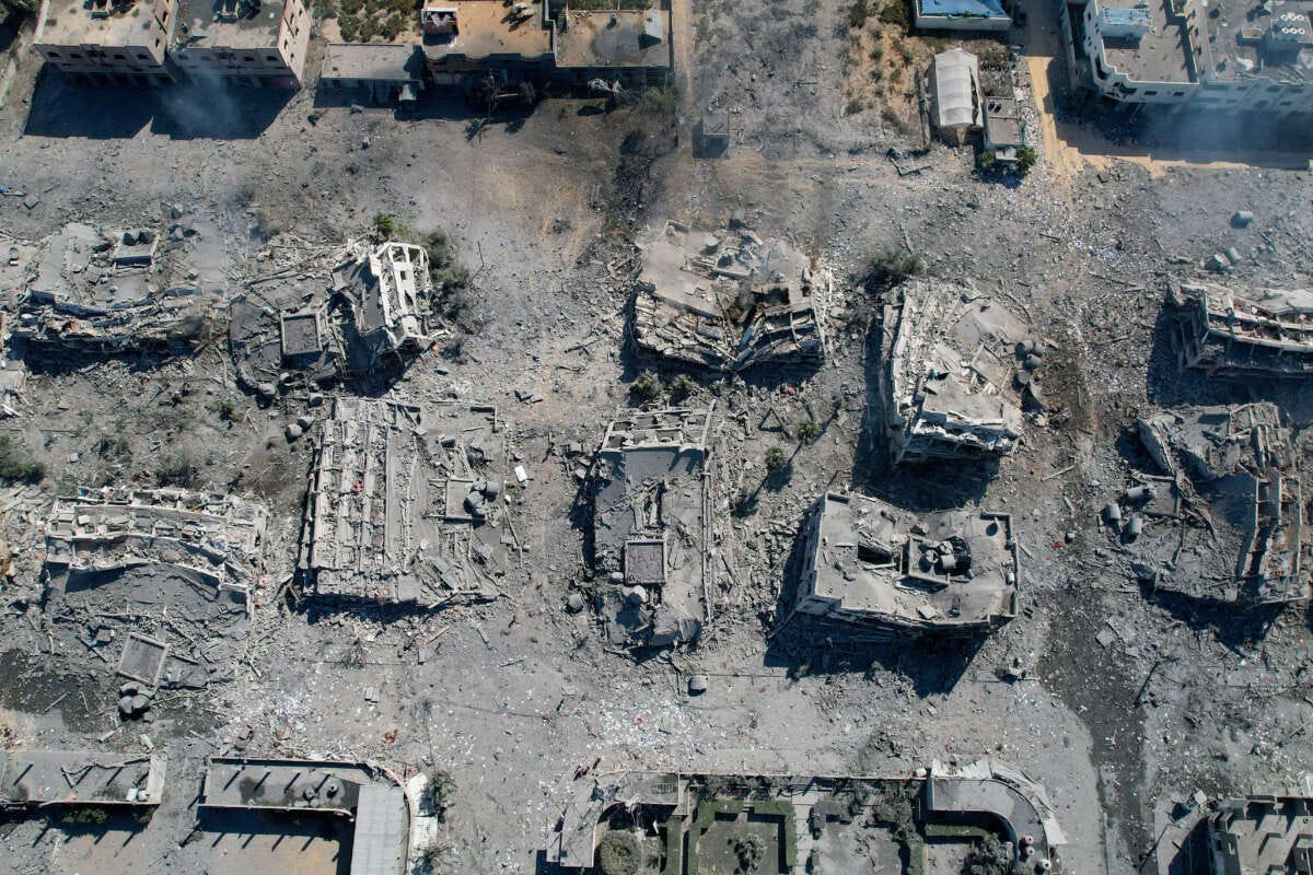An aerial view shows destroyed buildings in al-Zahra city in Gaza on October 20, 2023, following Israeli bombardment. The Israeli Air Force has already dropped more than 6,000 bombs on Gaza, one of the most densely populated areas in the world.