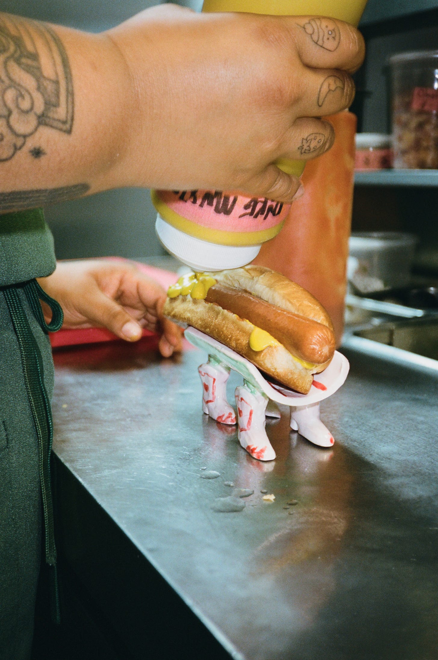 Chef Agua Lemus dresses a hot dog