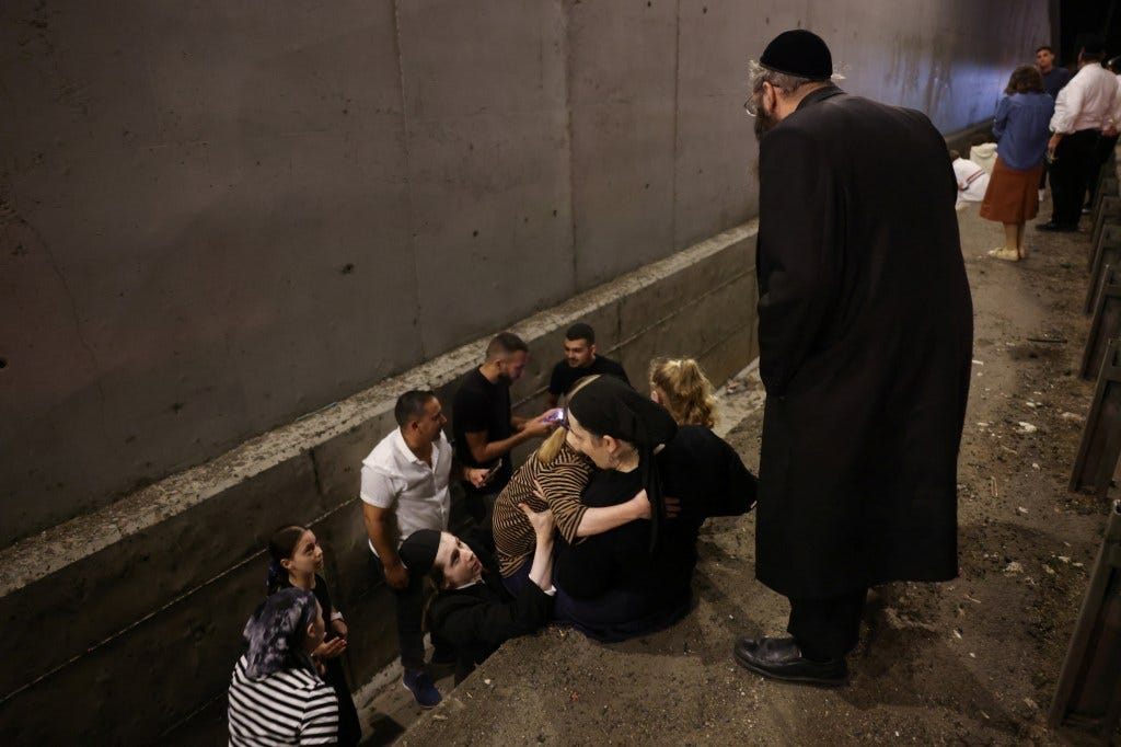 People take shelter in Israel amid the missile strikes.