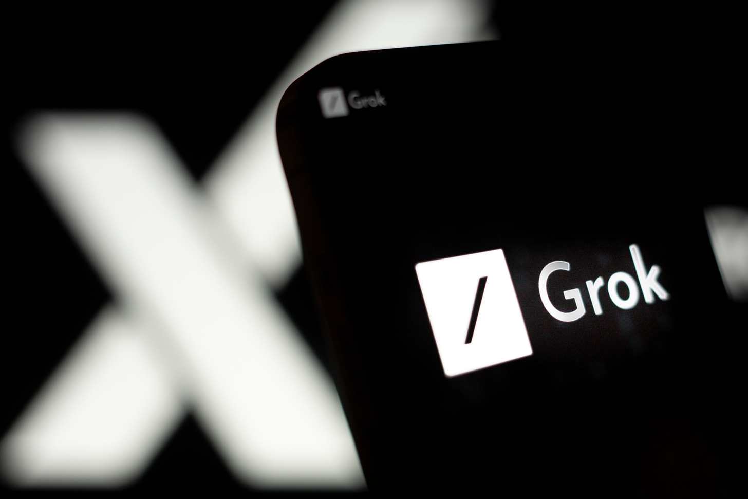 Photo illustration of the Grok logo on a phone. (Jaap Arriens / NurPhoto)