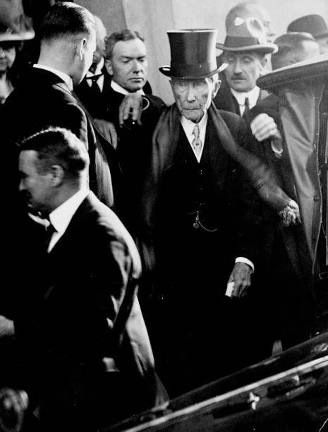John D. Rockefeller, Sr. And his son John, Jr. Leave a wedding in Greenwich, Connecticut. John D. Rockefeller, Sr. And his son John, Jr. Leave a wedding in Greenwich, Connecticut.