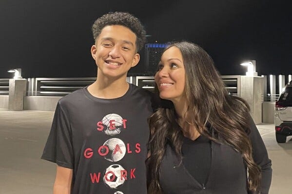 In this undated photo provided by Megan Garcia of Florida in October 2024, she stands with her son, Sewell Setzer III. (Courtesy Megan Garcia via AP)