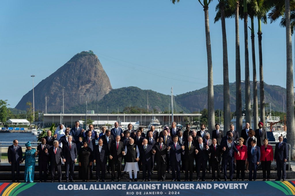 President Biden missed a group photo of G20 leaders on Monday — with a reporter spotting him instead behind a palm tree.