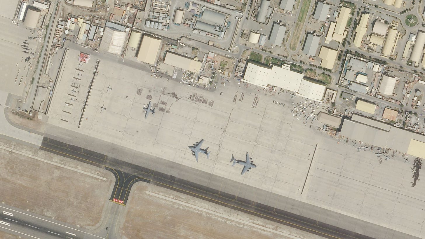 This satellite high-resolution SkySat image shows military transports as they arrive and depart, and queues of evacuees as they prepare to board the aircraft.