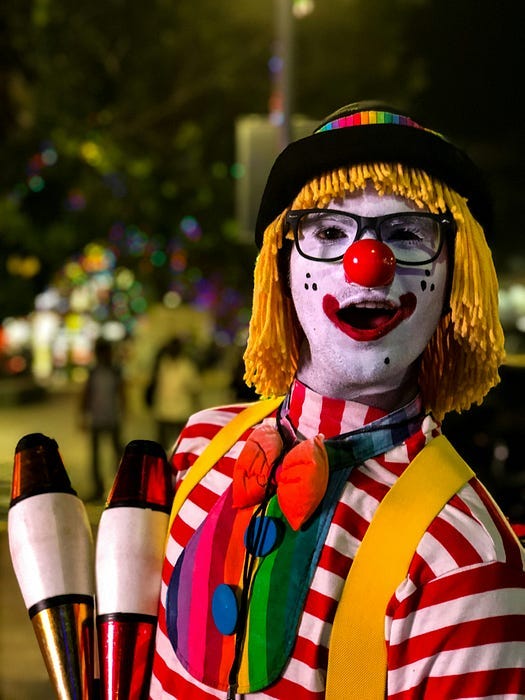 Smiling Clown with yellow wig.