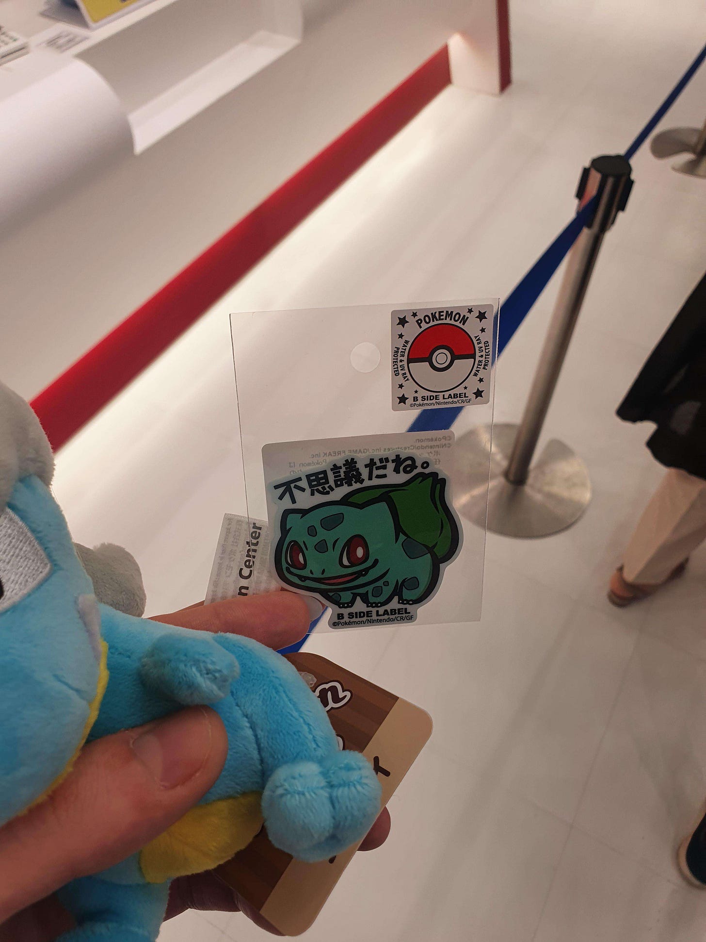 A Bagon plush and a Bulbasaur sticker from the Mega Tokyo Pokémon Center