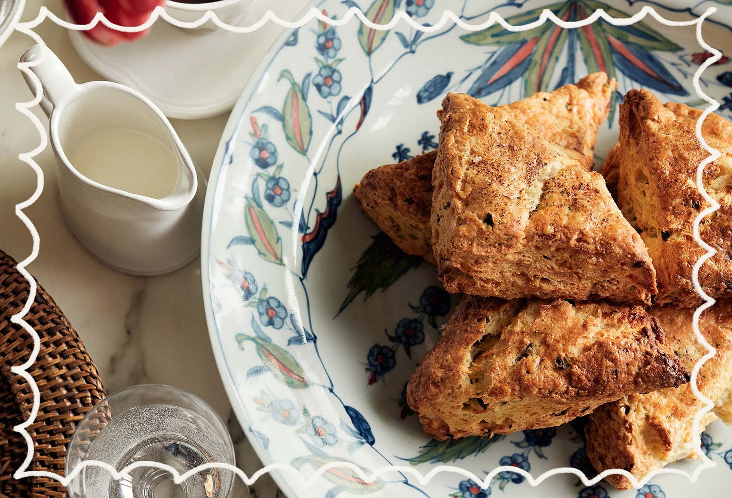 Claire Ptak's Sour Cream, Chive and Feta scones served on a blue and green patterned plate