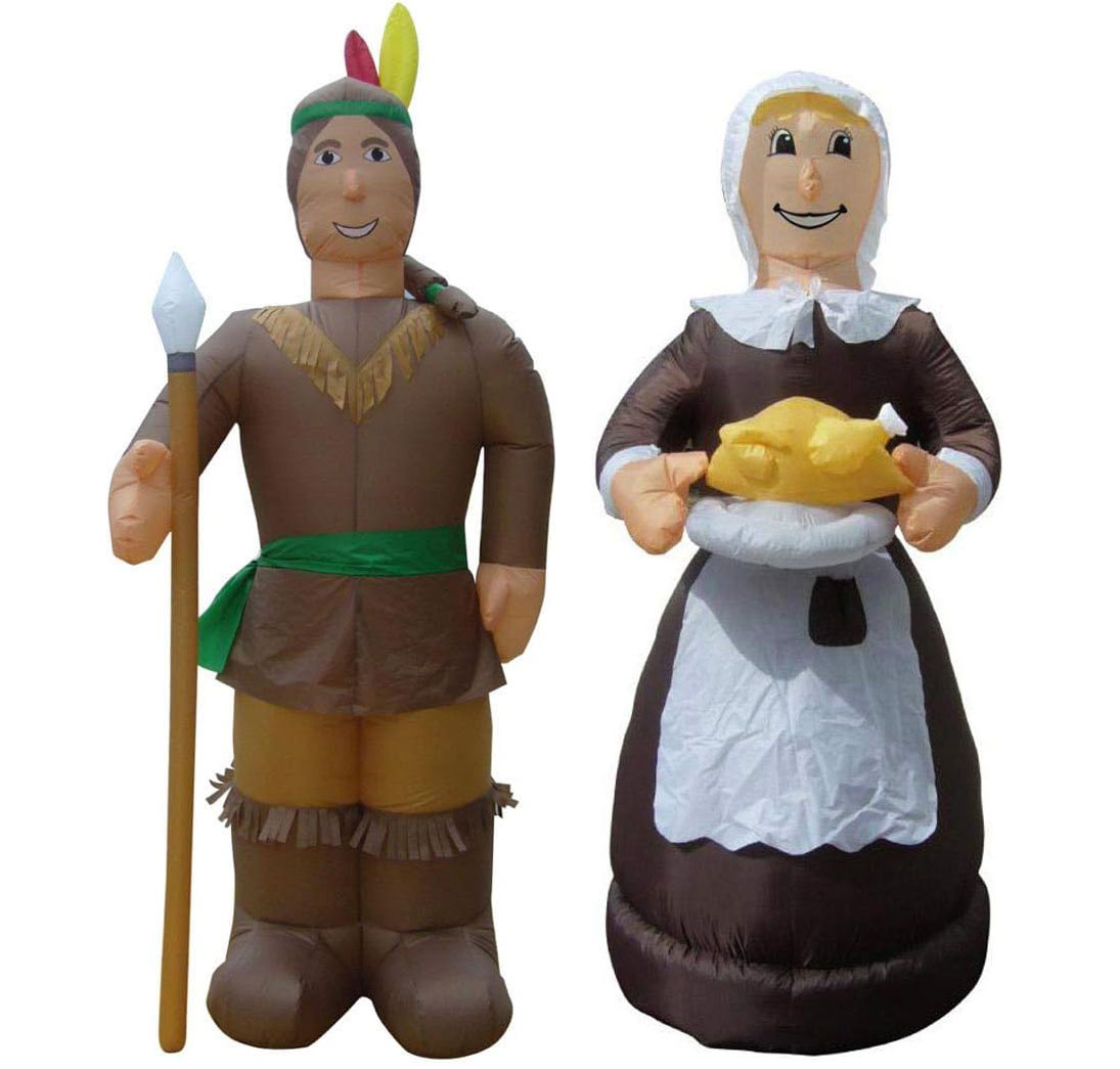 An inflatable Native American man holding a spear and an inflatable Pilgrim woman holding a turkey