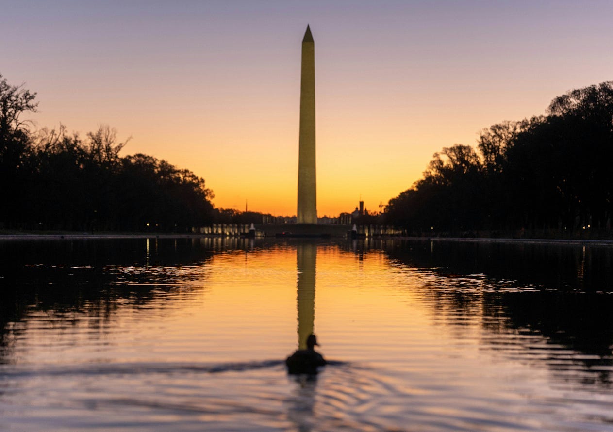 Photo by Harrison Mitchell on Unsplash of the sun setting behind the Washington Monument