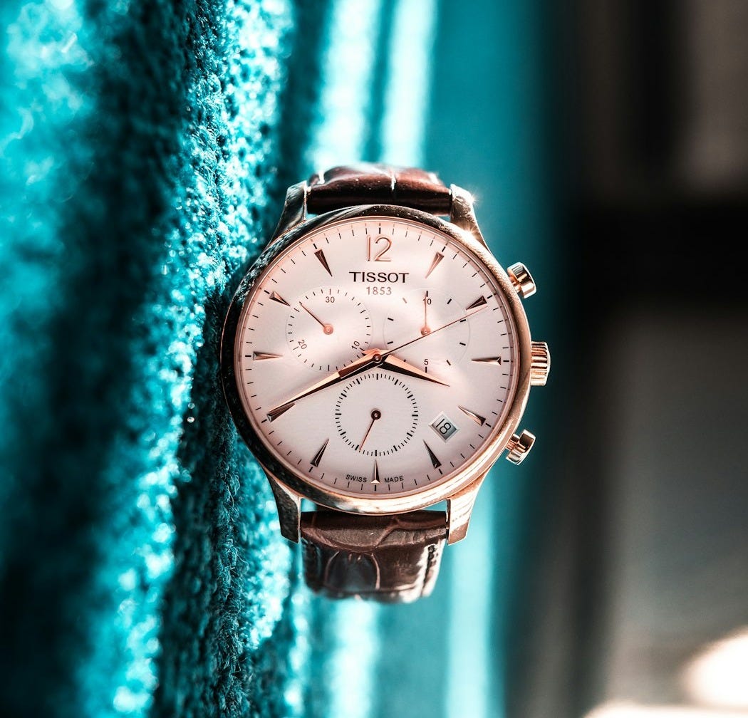 round silver-colored Tissot chronograph watch