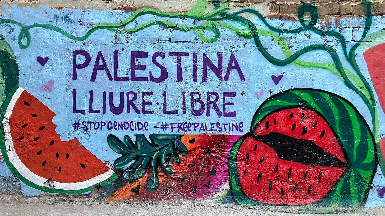 A mural painted on a wall in a street in Barcelona