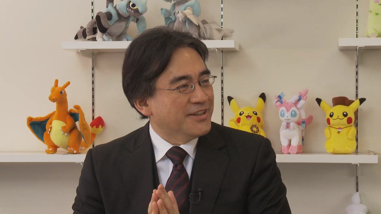 Iwata during an interview with Junichi Masuda (Director, now Chief Creative Fellow), and Tsunekazu Ishihara (President and CEO) in 2013