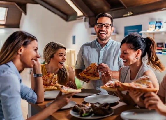 Happy people eating pizza and not fasting