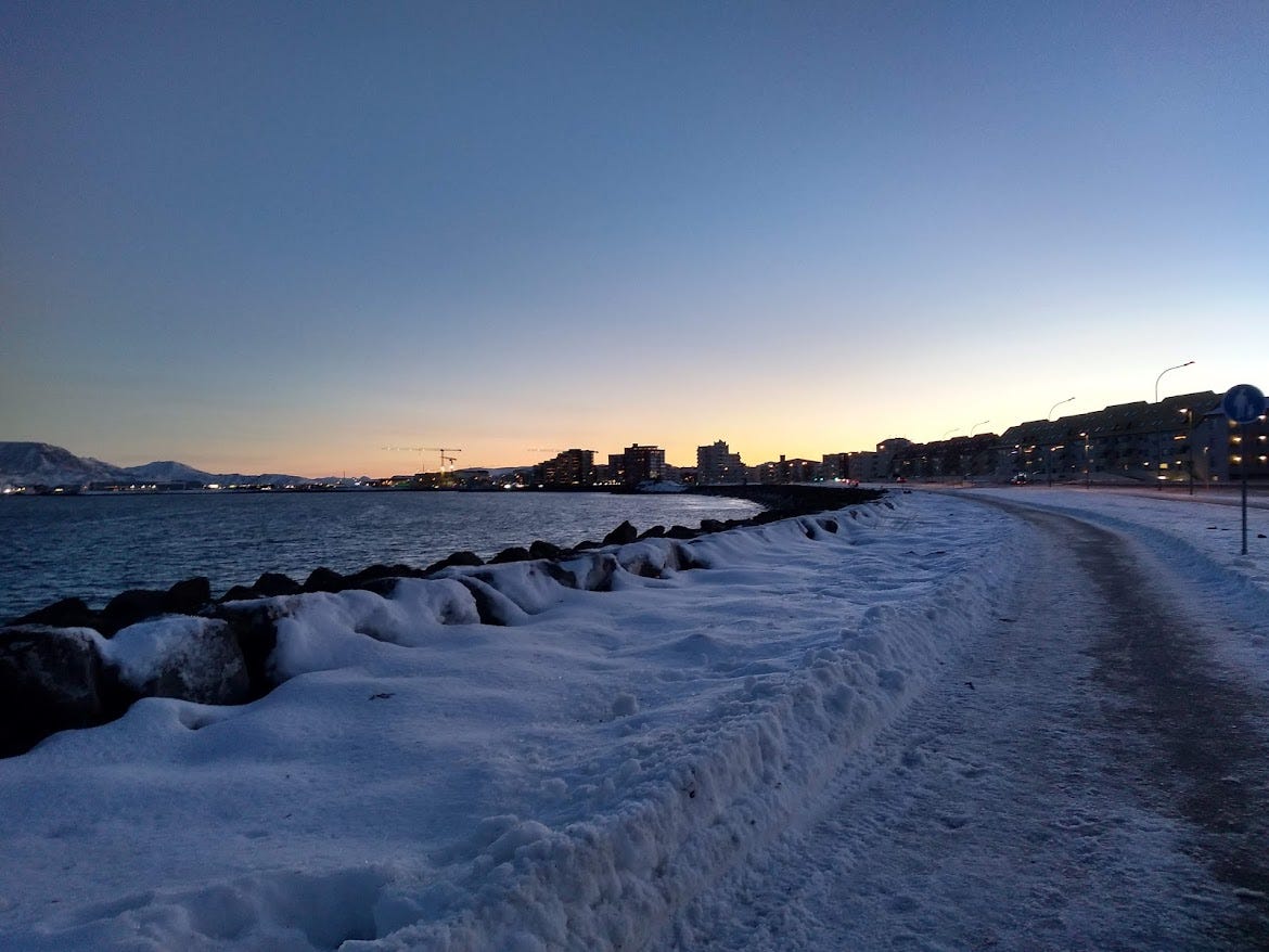 View of Rekyjavik at dawn from the perspective of the end of a long path around the coastline