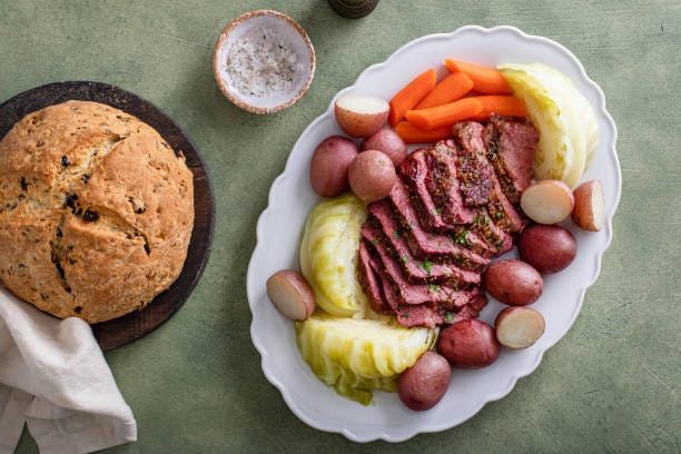 Corned beef with cabbage and potatoes on a serving platter Corned beef with cabbage and potatoes on a serving platter, irish recipe idea for St Patricks day corned beef and cabbage stock pictures, royalty-free photos & images
