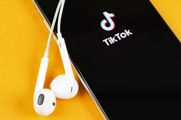 Tik Tok application icon on Apple iPhone X screen close-up. Tik Tok icon. tik tok application. Tiktok Social media network. Social media icon