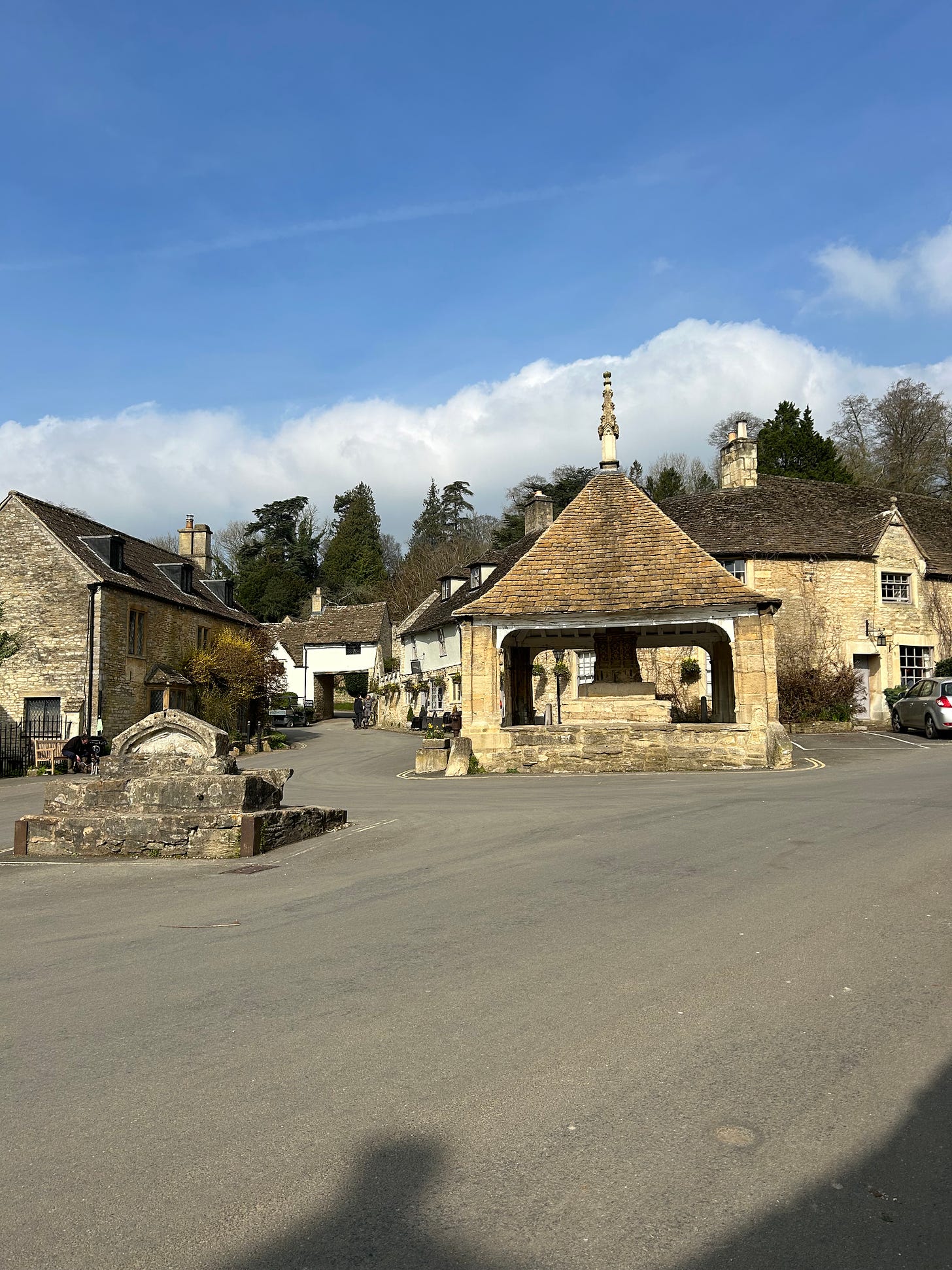 The Market Cross with its roof and in front of it is the Castle Combe Buttercross where butter would have once been sold at the market. Image: Roland’s Travels